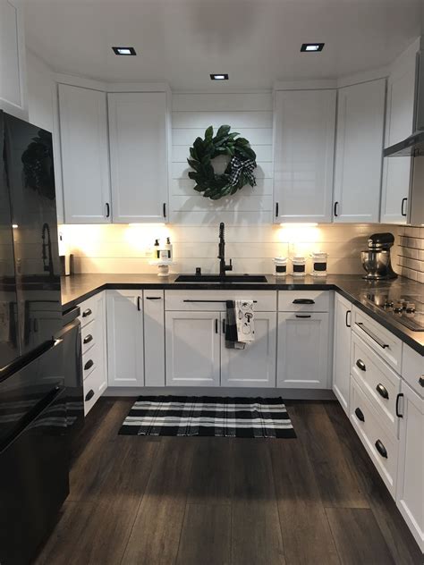Farmhouse kitchen colors vary and will depend on your cabinetry, countertop, and rustic decor. Farmhouse meets modern design. Shiplap, subway tile, black ...