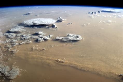 Dust And Clouds Dance Over The Sahara A Massive Dust Storm Filled The