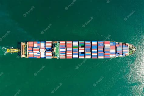 Premium Photo Aerial Top View Of Cargo Ship Carrying Container For