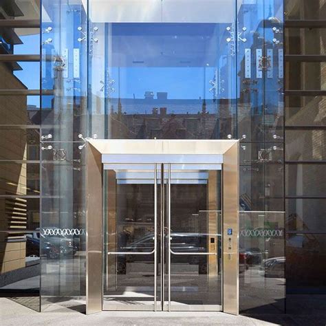an open glass door on the side of a building