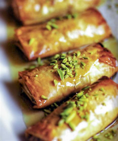 Place a sheet of phyllo dough on parchment paper. Phyllo Pastries with Nuts and Honey Recipe | Leite's Culinaria