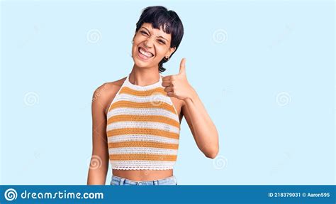 Young Brunette Woman With Short Hair Wearing Casual Clothes Doing Happy