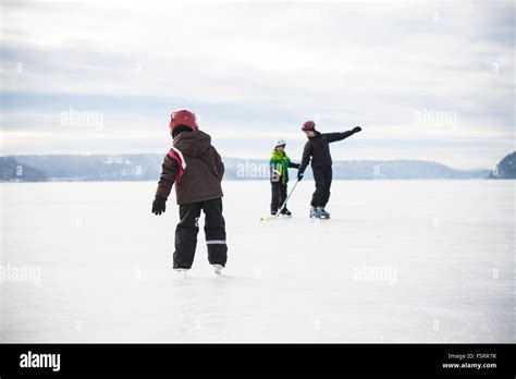 Sweden Vastergotland Lerum Lake Aspen Mom Playing Ice Hockey With
