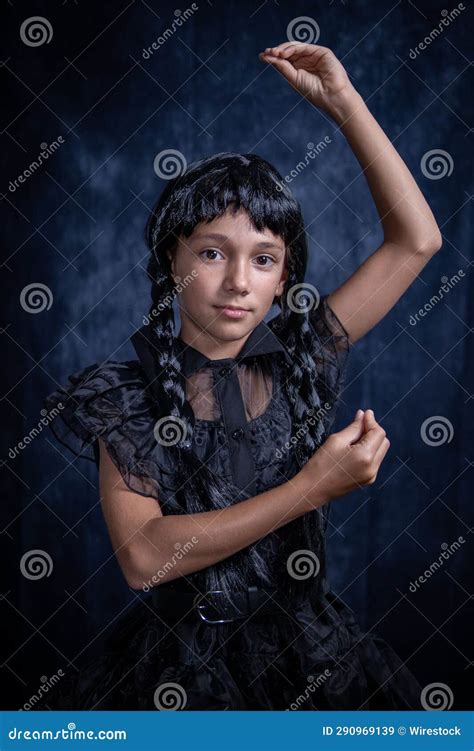 A Little Girl Is Posing In Black Dress In A Studio Stock Image Image