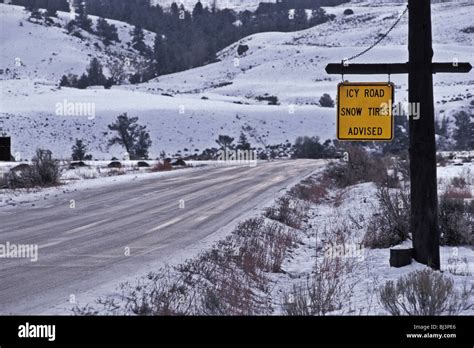 Icy Road Snow Tires Advised Caution Sign Yellowstone National Park