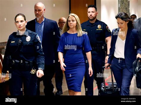 Former Dallas police officer Amber Guyger, center, arrives for the