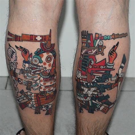 Cool Looking Colorful Abstract Style Various Statue Tattoo On Legs Tattooimages Biz