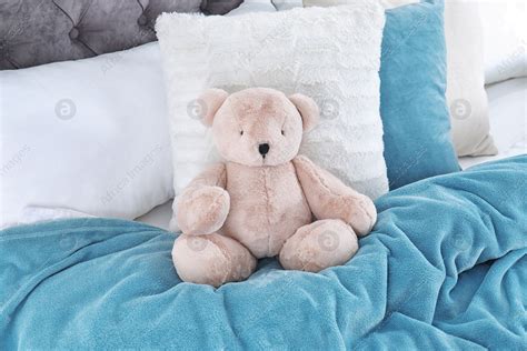Cute Teddy Bear Sitting On Bed Indoors Stock Photo Download On