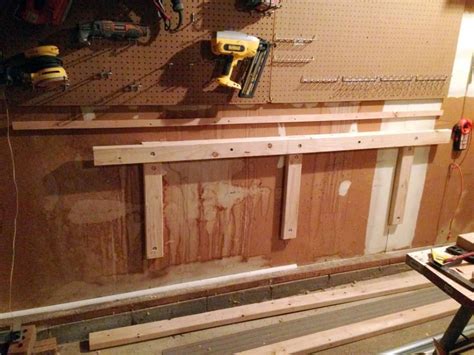 Build A Diy Folding Workbench With Storage Above For Your Garage Or