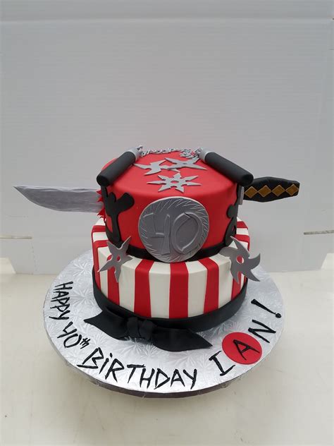 2 Tiered Full Fondant Coverage Ninja Cake With Accessories Made Out Of