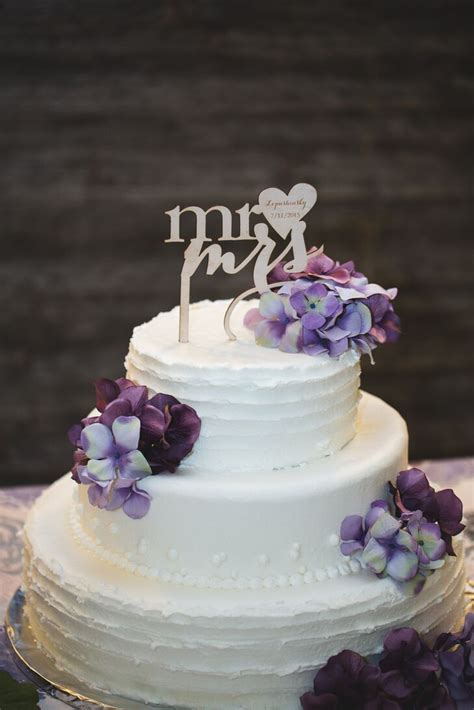 See more ideas about cake, cupcake cakes, pretty cakes. Two-Tier White Wedding Cake With Purple Flowers