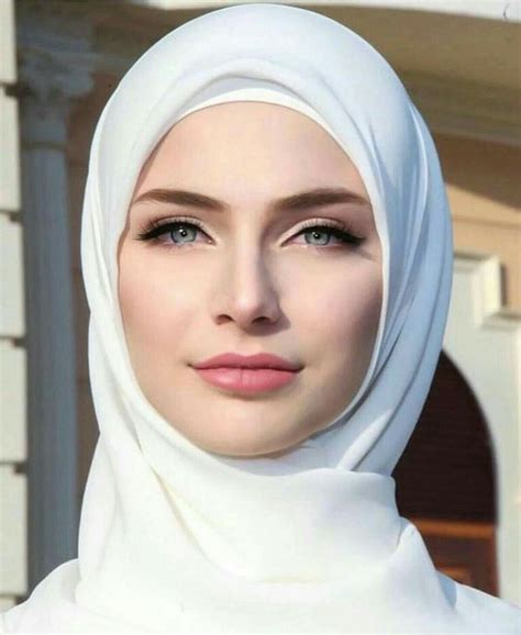 a woman wearing a headscarf and looking at the camera