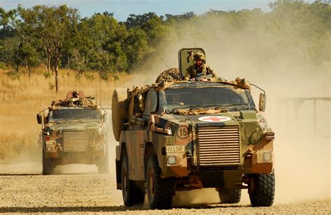 An Australian Army Ambulance Bushmaster Leads The Push As It Responds