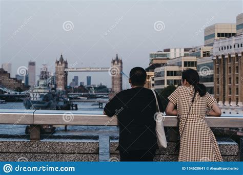 Rear View Of Two People Admiring The View Of Tower Bridge From London