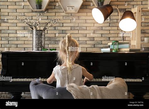 Little Girl Playing Piano Indoors Stock Photo Alamy