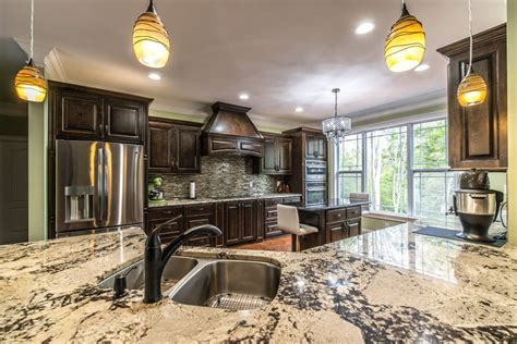 Browse photos of granite kitchen countertops of various styles to see designs that can fit into your next kitchen this newly remodeled kitchen boasts a tiled backsplash and granite countertops. Granite Countertops Greenville SC | East Coast Granite & Tile