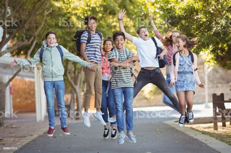 Smiling School Kids Having Fun On Road In Campus Stock Photo - Download 
