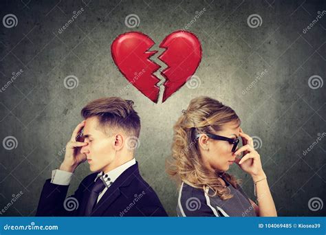 Rift In Relations Sad Couple Standing Back To Back With Broken Heart