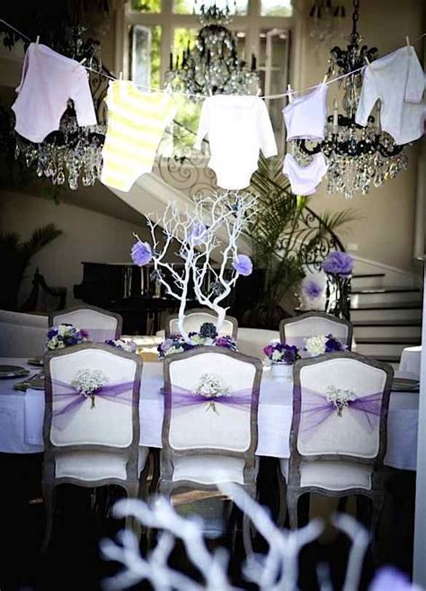 Baby shower ideas for girls. I love the white branches as centerpieces & the onesies ...