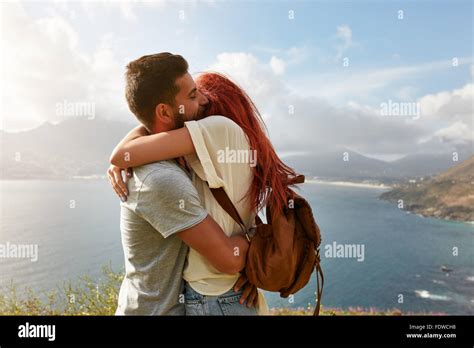 Portrait of a happy young couple enjoying a romantic embrace outdoors