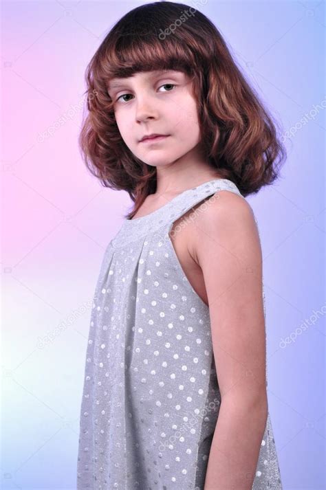 Pretty 8 Year Old Girl In Silver Dress — Stock Photo © Cherry Merry