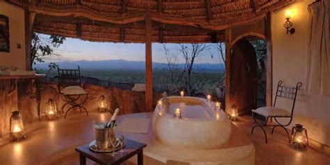 Father with two toddlers getting ready for the bath in the bathroom at home. 6 Stunning outdoor bath tubs in Africa - Somak Luxury Travel