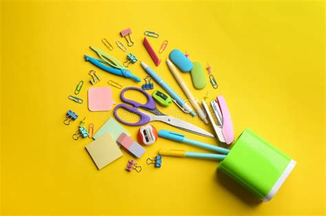 Flat Lay Composition With School Stationery On Yellow Background Back