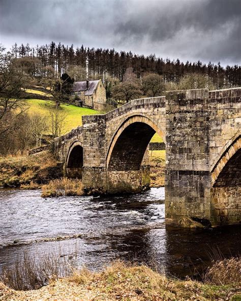 The River Wharfe Under Dark Clouds At Barden Bridge Yorkshire Dales