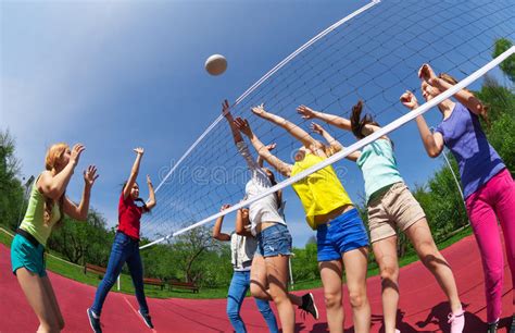 It is not intended for promotion any illegal things. Active Teenagers Playing Volleyball On Game Court Stock ...