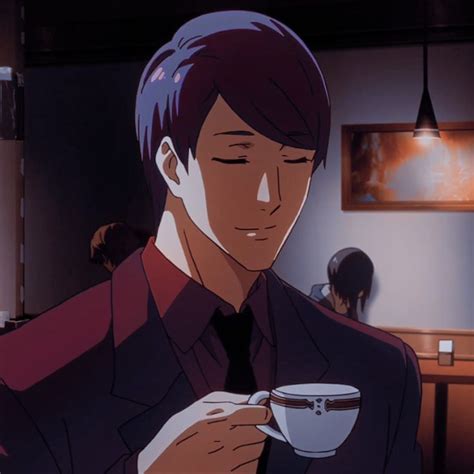 A Man In A Suit Holding A Coffee Cup