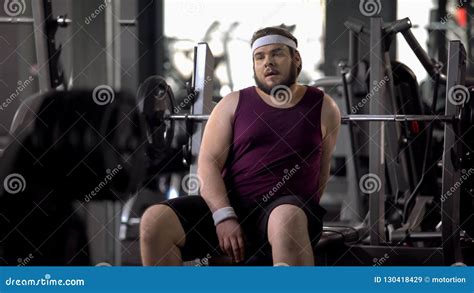 Tired Fat Man Having Rest After Workout Exercise Strength Of Muscles