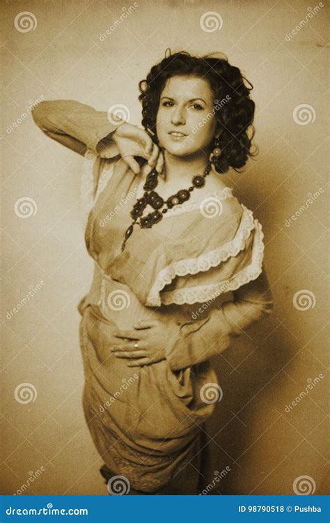 Photo Of Curly Brunette In Retro Style With Sepia Effect Stock Photo