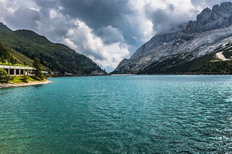 Beautiful Mountain Lake In Dolomites With Heavy Clouds On The