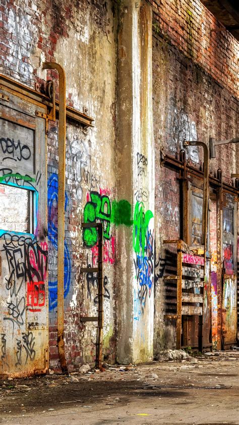 Download Graffiti Wall Art On An Old Building Wallpaper