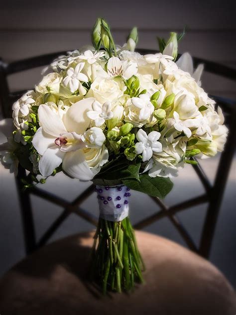 Bridal Bouquet Of Roses Cymbidium Orchids Stephanotis Freesia