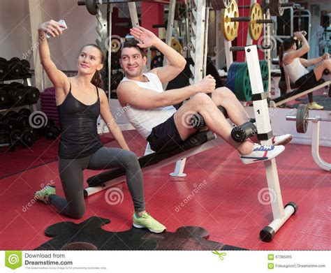 Girl And Guy Taking Pictures In The Gym Stock Image Image Of Mobile