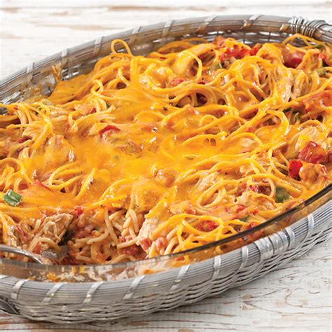 This cheesy baked chicken spaghetti has a rich and creamy alfredo sauce, zesty tomatoes and veggies, and a gooey cheddar cheese topping. Cheesy Baked Chicken Spaghetti - Paula Deen Magazine