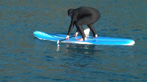 Fat Man In A Wetsuit Trying To Paddleboard Youtube