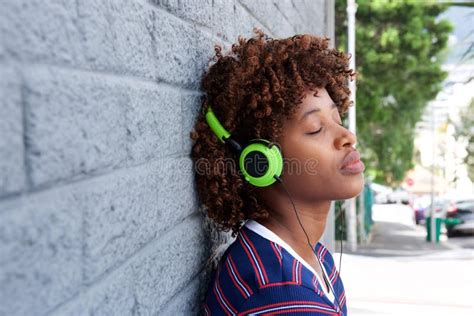 African Woman Listening To Music With Headphones Stock Image Image Of