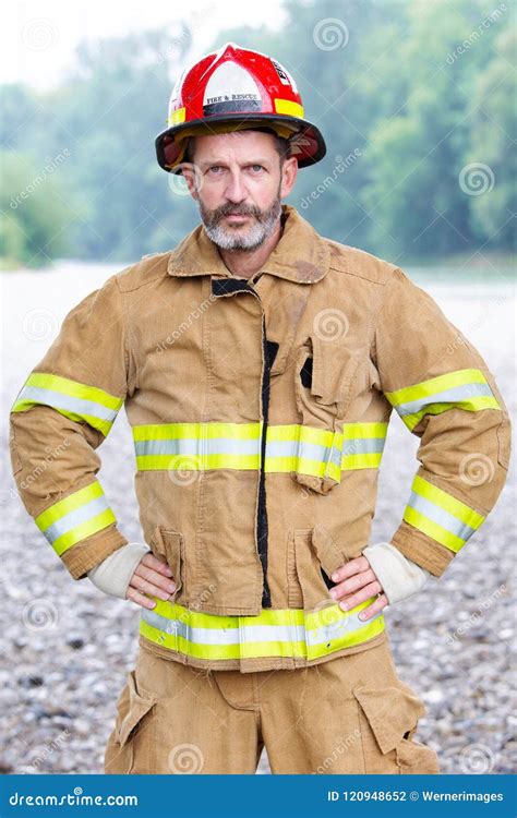 Portrait Of Handsome Fireman In Uniform Stock Photo Image Of Crew