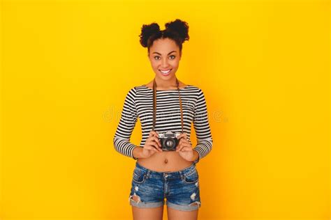 Young African Woman Isolated On Yellow Wall Studio Teen Style