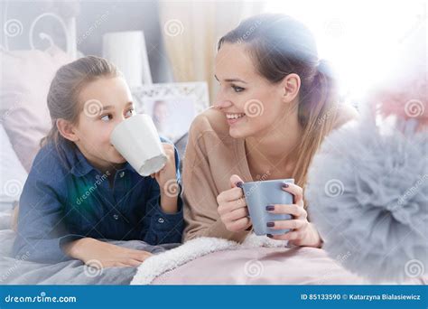 Mother And Daughter With Cups Stock Photo Image Of Confidences