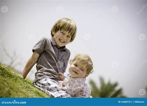 Brother And Sister On The Grass Stock Image Image Of Dress Hugging 24489721