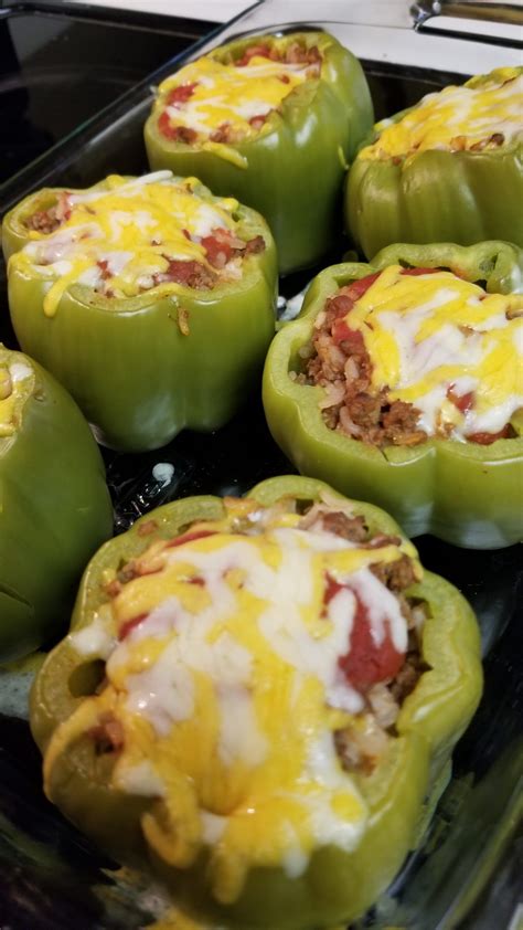 Green Peppers Stuffed With Ground Beef And Rice And Topped With A