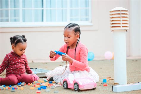 Cute Little Black Girls Playing With Toys On Floor · Free Stock Photo