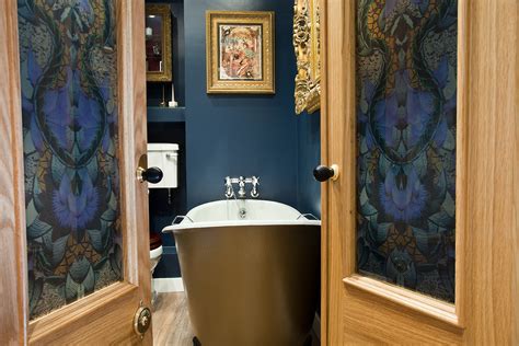 Glamorous Bathroom Boudoir With Rich Blue Walls And Gold Accents —hove