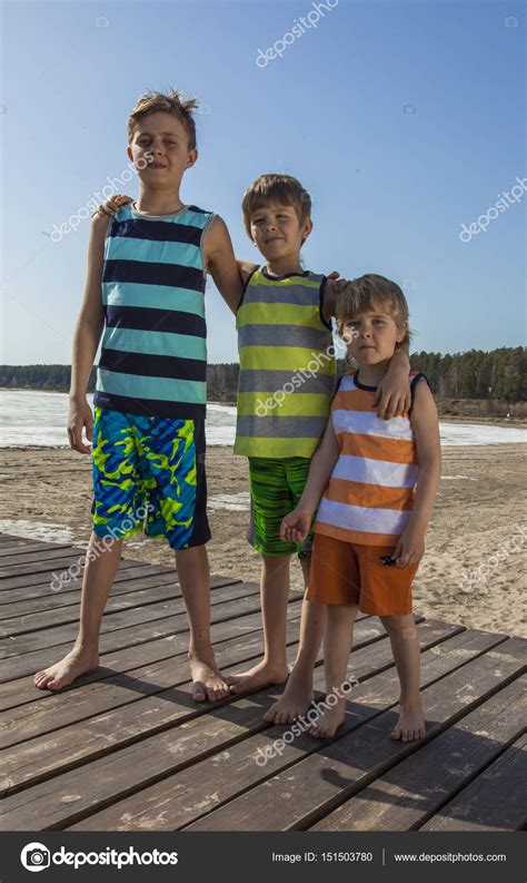 Three Happy Boys Hugging On The Beach ⬇ Stock Photo Image By