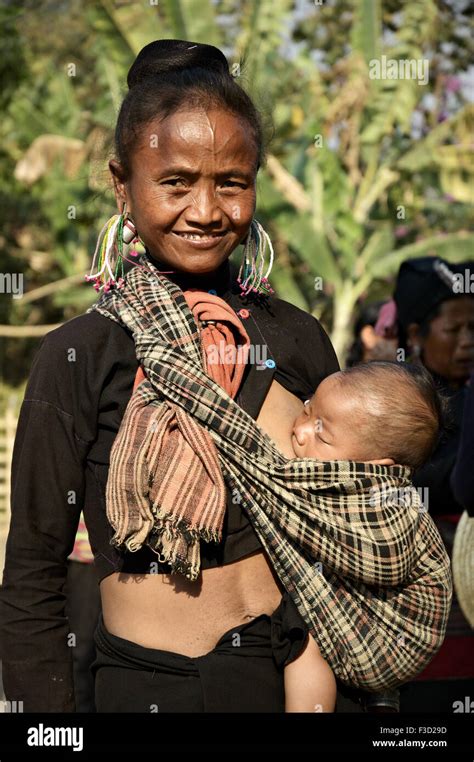 Mom Of The Ann Tribe Breastfeeding Her Baby In A Village Around