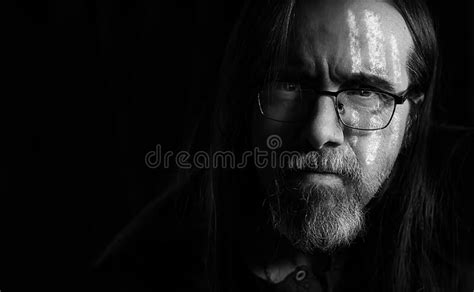 Mid Adult Man With Beard Long Hair White War Paint On His Face And Confidence In His Eyes