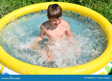 Boy Splashing Water Stock Photo Image Of Playing Outdoor 74880452